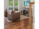 Cozy sitting area with leather chairs, hardwood floors, built-in bar, and bright natural light at 1207 W New Hampshire St, Orlando, FL 32804