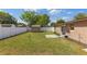 Expansive backyard featuring lush greenery, a small shed, and privacy fencing, ideal for recreation at 1219 Blue Spring Ct, Ocoee, FL 34761