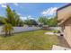 Serene backyard with manicured lawn, shed, and privacy fence, offering a peaceful retreat at 1219 Blue Spring Ct, Ocoee, FL 34761
