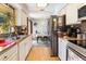 Kitchen with butcher block counters, stainless steel appliances, and view of dining area at 1219 Blue Spring Ct, Ocoee, FL 34761