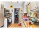 Bright kitchen featuring butcher block counters, stainless steel appliances, and backsplash at 1219 Blue Spring Ct, Ocoee, FL 34761