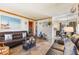 Comfortable living room featuring a dark leather sofa and stylish decor at 1219 Blue Spring Ct, Ocoee, FL 34761