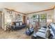 Cozy living room featuring tile floors, natural light, and nautical themed decor at 1219 Blue Spring Ct, Ocoee, FL 34761