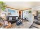 Comfortable living room featuring a dark leather sofa and stylish decor at 1219 Blue Spring Ct, Ocoee, FL 34761
