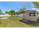 Charming backyard with a shed, well-manicured lawn, and a privacy fence, great for storage at 1219 Blue Spring Ct, Ocoee, FL 34761