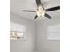 Bedroom with two windows, wood-look floors, and a ceiling fan at 13 Fanfair Ave, Orlando, FL 32811