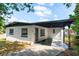 Charming single-story home with a covered front porch and well-maintained landscaping at 13 Fanfair Ave, Orlando, FL 32811