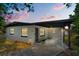 Inviting exterior view of this single-story home, complete with covered parking and fresh landscaping at 13 Fanfair Ave, Orlando, FL 32811