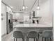 Beautiful kitchen featuring stainless steel appliances, white cabinets, and a breakfast bar area at 13 Fanfair Ave, Orlando, FL 32811