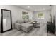 Comfortable living room with neutral tones, adjacent to a stylish, well-lit kitchen area at 13 Fanfair Ave, Orlando, FL 32811