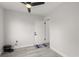 This room features wood-look floors, a ceiling fan, and convenient access to an exterior door at 13 Fanfair Ave, Orlando, FL 32811
