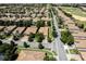 Aerial view of the community homes and the meticulously kept street, offering a peaceful neighborhood setting at 1300 Island Green St, Davenport, FL 33896