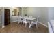 Elegant dining room with a table for six and stylish decor at 1300 Island Green St, Davenport, FL 33896