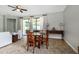 Dining area with natural light, tile flooring, and a ceiling fan overlooking the outside patio at 1300 Island Green St, Davenport, FL 33896