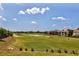 Picturesque view of the manicured golf course, featuring sand traps and a lush green landscape at 1300 Island Green St, Davenport, FL 33896
