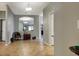 Hallway with tile flooring and decor leading into a home featuring open space and modern lighting at 1300 Island Green St, Davenport, FL 33896