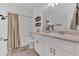 Well-lit bathroom with a shower/tub combo and stylish fixtures, ideal for relaxation at 1312 Axel Graeson Ave, Kissimmee, FL 34744