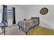 Comfortable bedroom featuring neutral tones and carpet flooring at 1312 Axel Graeson Ave, Kissimmee, FL 34744