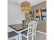 A closer view of the dining room highlights modern accents and decor at 1312 Axel Graeson Ave, Kissimmee, FL 34744