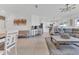 Open-concept living space with a large sectional, modern decor, and abundant natural light at 1312 Axel Graeson Ave, Kissimmee, FL 34744