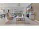 Bright living room featuring a large sectional sofa, stylish lighting, and neutral decor at 1312 Axel Graeson Ave, Kissimmee, FL 34744