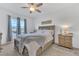 Relaxing main bedroom features a ceiling fan and plush rug for ultimate comfort at 1312 Axel Graeson Ave, Kissimmee, FL 34744
