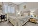 Comfortable bedroom with a neutral color palette, stylish decor, and soft natural light at 13299 Serene Valley Dr, Clermont, FL 34711