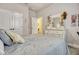 Bedroom with a comfortable bed, soft pillows, and closet space at 13299 Serene Valley Dr, Clermont, FL 34711