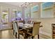 Charming dining room with rustic wood table, stylish seating, and natural light at 13299 Serene Valley Dr, Clermont, FL 34711