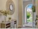 Inviting entryway featuring stylish decor and a glimpse of the outdoors at 13299 Serene Valley Dr, Clermont, FL 34711
