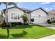 Well-maintained lawn complements the home's facade, enhancing its curb appeal at 13299 Serene Valley Dr, Clermont, FL 34711