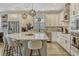 Bright kitchen featuring white cabinets, stainless steel appliances, and a large center island at 13299 Serene Valley Dr, Clermont, FL 34711