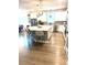 Modern kitchen featuring a spacious island with bar seating and stainless steel appliances at 13299 Serene Valley Dr, Clermont, FL 34711