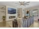 Stylish living room features a cozy fireplace and modern entertainment setup at 13299 Serene Valley Dr, Clermont, FL 34711