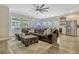 Open-concept living room with a modern bar area and comfortable seating at 13299 Serene Valley Dr, Clermont, FL 34711