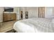 Bedroom featuring wood flooring and an ensuite bathroom beyond an open door at 13299 Serene Valley Dr, Clermont, FL 34711