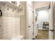Convenient mud room with built-in bench and storage, plus a view into the laundry room at 13299 Serene Valley Dr, Clermont, FL 34711