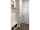 Mudroom features convenient storage, a bench with storage, and hooks for organization at 13299 Serene Valley Dr, Clermont, FL 34711