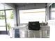 Outdoor kitchen featuring granite counters, stainless steel appliances and backyard views at 13299 Serene Valley Dr, Clermont, FL 34711