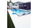 Backyard swimming pool featuring sun shelf, basketball hoop, and outdoor seating at 13299 Serene Valley Dr, Clermont, FL 34711