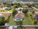 Desirable home with a pool, lush yard, and a convenient circular driveway at 1441 Olde Kensington Ln, Deltona, FL 32725