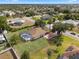 Well-maintained property with a screened-in pool and spacious yard surrounded by lush greenery at 1441 Olde Kensington Ln, Deltona, FL 32725