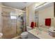 Bathroom with a glass-door shower and vanity with sink at 1441 Olde Kensington Ln, Deltona, FL 32725