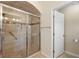 Bathroom featuring a glass-enclosed shower and a toilet at 1441 Olde Kensington Ln, Deltona, FL 32725