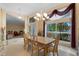 Formal dining room featuring a large window and seamless access into the living room at 1441 Olde Kensington Ln, Deltona, FL 32725