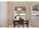 Dining area featuring a sliding glass door and a view of the pool at 1441 Olde Kensington Ln, Deltona, FL 32725