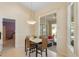Dining area with a sliding glass door to an outdoor area with seating at 1441 Olde Kensington Ln, Deltona, FL 32725