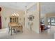Open-concept dining area with tray ceilings seamlessly flowing into the living space of the home at 1441 Olde Kensington Ln, Deltona, FL 32725