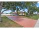 Long driveway with a patterned brick design leading to this well-kept residential home at 1441 Olde Kensington Ln, Deltona, FL 32725