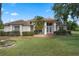 Charming home featuring a well-manicured lawn, mature landscaping, and a welcoming front entrance at 1441 Olde Kensington Ln, Deltona, FL 32725